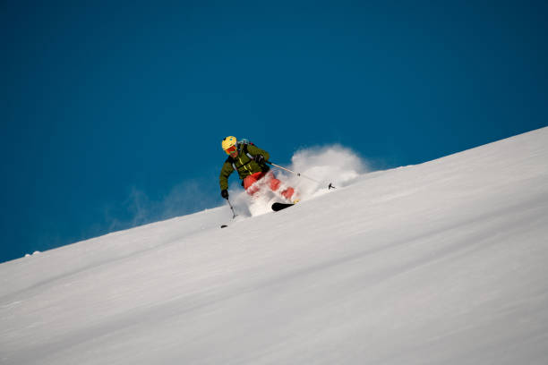 istock Male skier slides down on the mountain side 1206835352