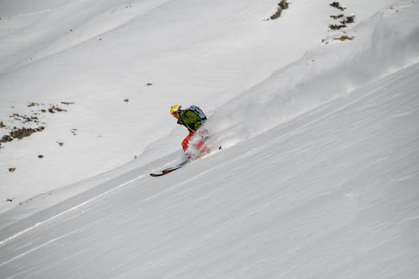 istock Male skier rides down on the mountain slope 1206835468