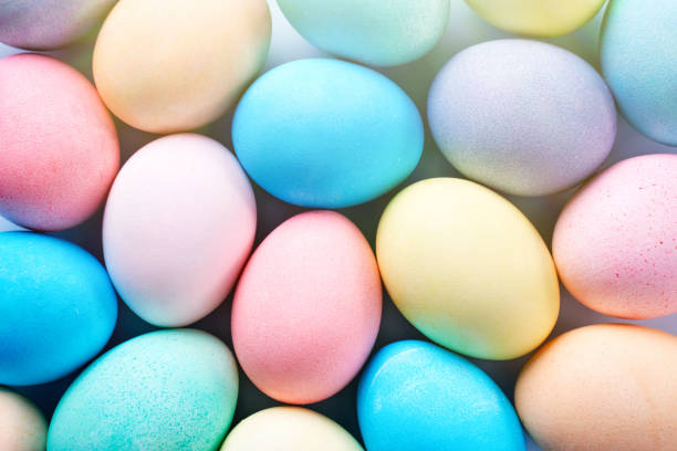 istock Colorful Easter eggs dyed by colored water with beautiful pattern on a pale blue background, design concept of holiday activity. 1206835742