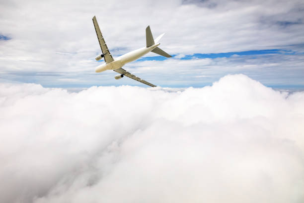 istock Airplane flying at high altitude and beautiful high-altitude clouds in spring 1206836292