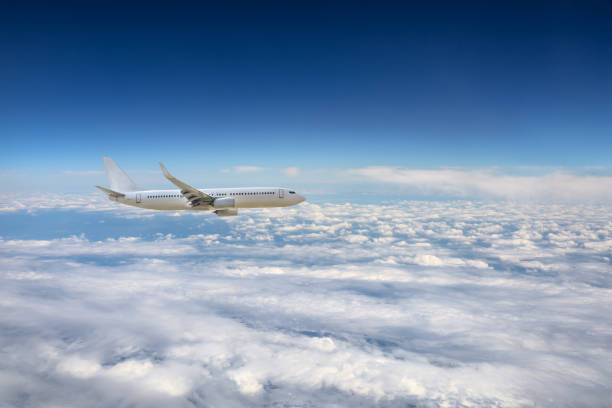 istock Airplane flying at high altitude and beautiful high-altitude clouds in spring 1206837037