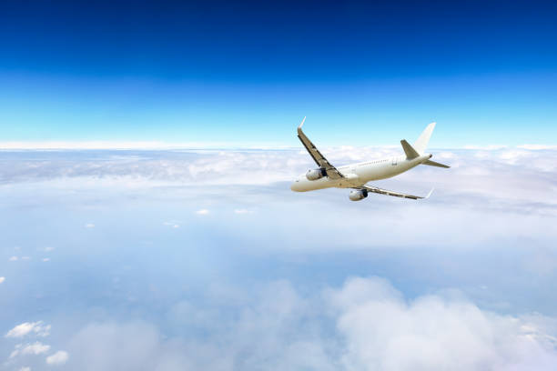 istock Airplane flying at high altitude and beautiful high-altitude clouds in spring 1206837210