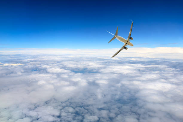 istock Airplane flying at high altitude and beautiful high-altitude clouds in spring 1206837548