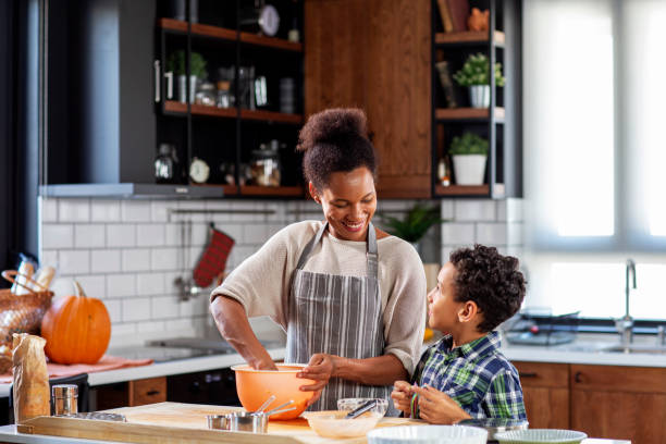 istock Mother with his son prepare pie in the kitchen 1206838400