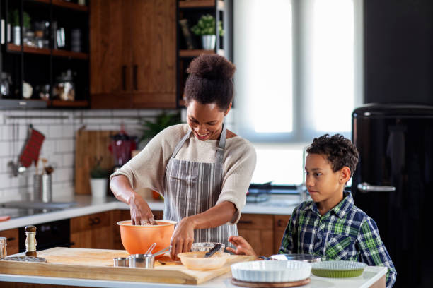 istock Mother with his son prepare pie in the kitchen 1206838431