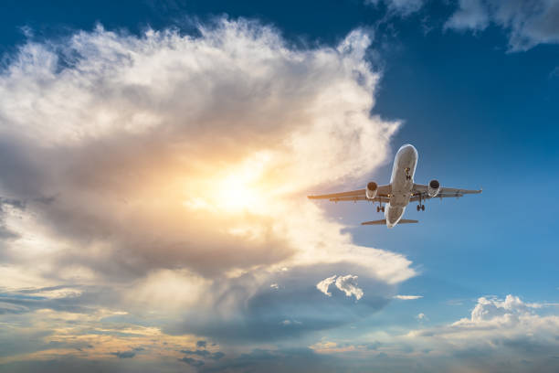 istock High-altitude airplane and beautiful sky at dusk 1206839721