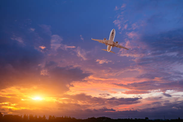 istock High-altitude airplane and beautiful sky at dusk 1206839722
