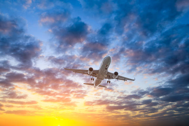 istock High-altitude airplane and beautiful sky at dusk 1206839726