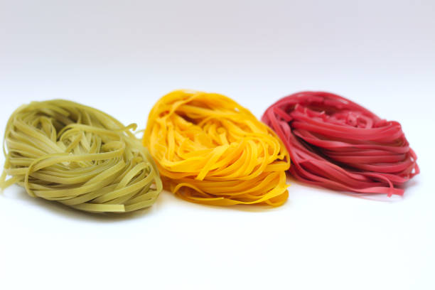 istock Isolated colored spaghetti nests on a white background 1206841320