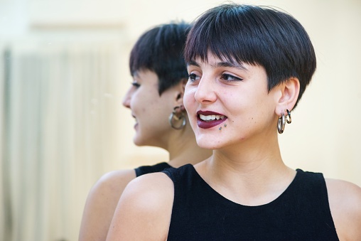 Portrait of a young dancer looking away from the camera.