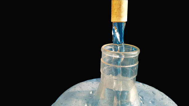 istock Filling drinking water in the cane with the black background 1206841533