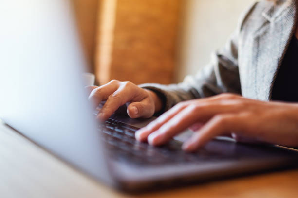 istock a woman working and typing on laptop computer keyboard on the table 1206843259