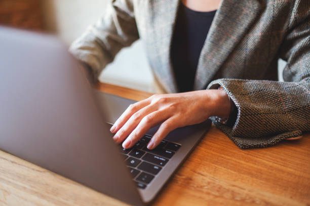 istock a businesswoman working and typing on laptop computer keyboard on the table 1206843290