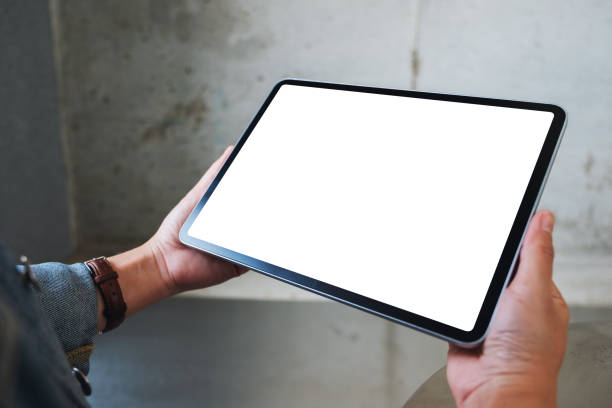istock a woman holding black tablet pc with blank white screen in cafe 1206843326
