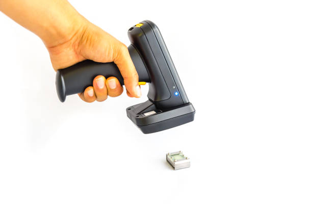 istock Working barcode reader in Asian male hand scanning metal RFID tag isolated on white 1206849560