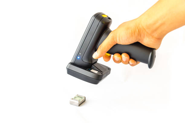 istock Working barcode reader in Asian male hand scanning metal RFID tag isolated on white 1206849618