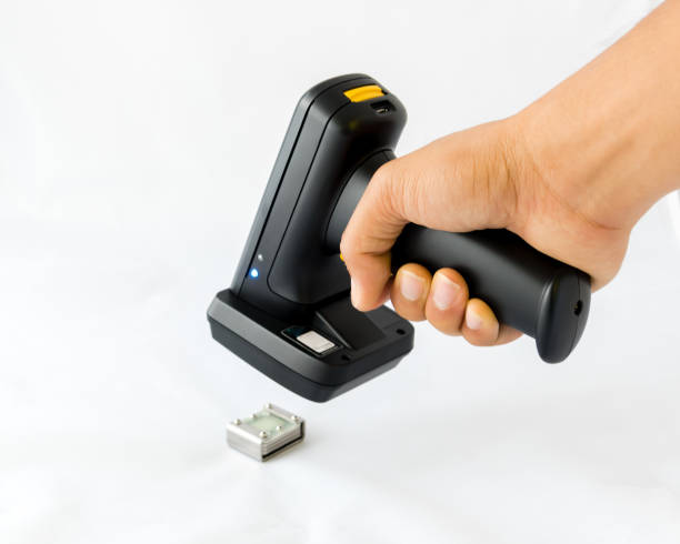istock Working barcode reader in Asian male hand scanning metal RFID tag isolated on white 1206849649