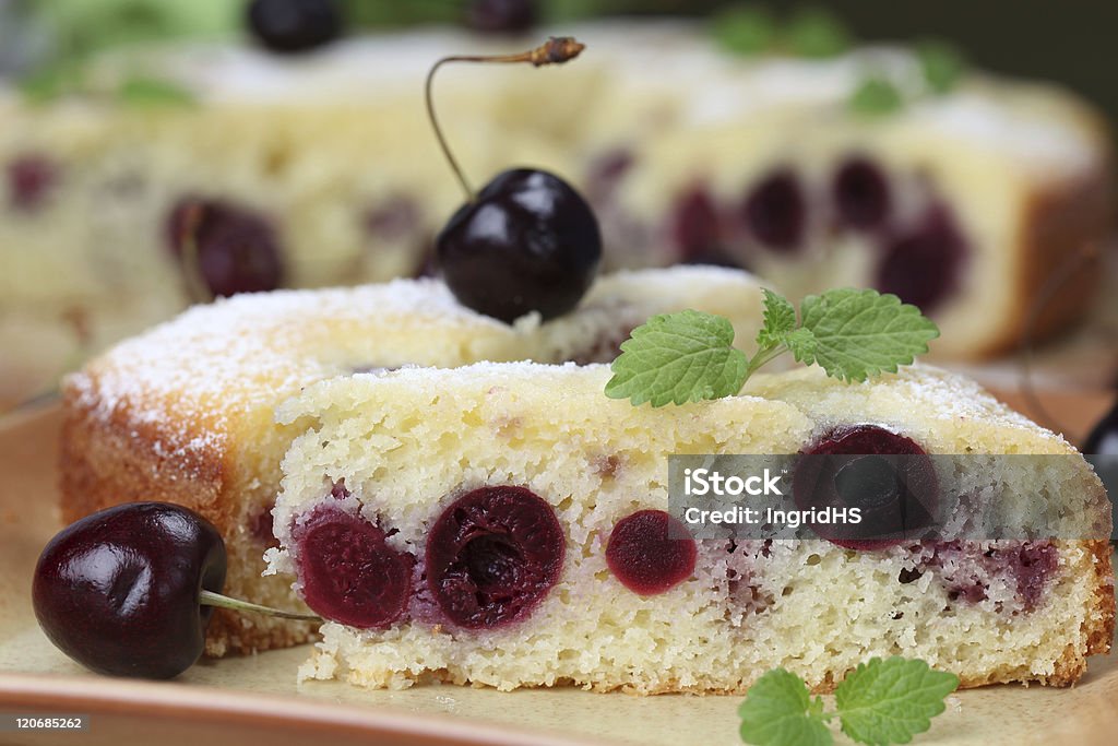 Black cherry cake Delicious homemade sponge cake with black cherries. Shallow DOF,  Baked Stock Photo