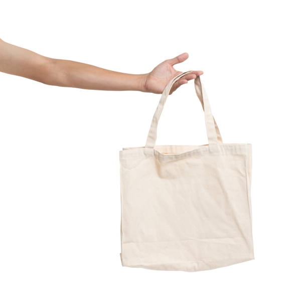 istock Hand man holding bag canvas fabric blank for mockup isolated on white background. 1206854803
