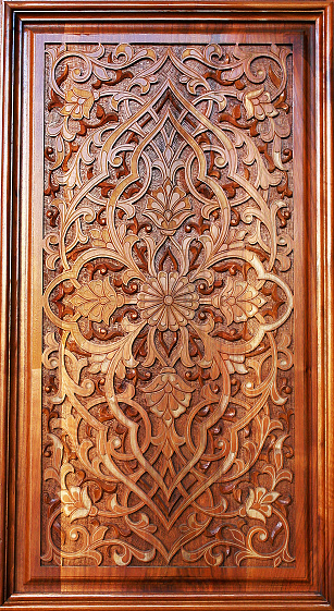 Beautiful patterns, wooden carved on the door.Oriental craft.