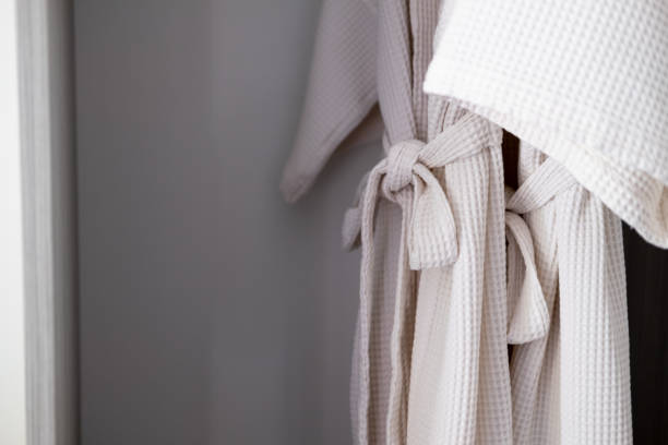 istock Close up clean white bathrobe in wardrobe 1206856976