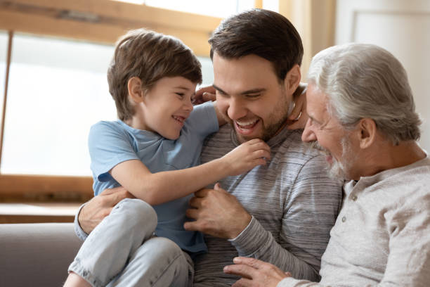 istock Joyful laughing different generations carefree family having fun indoors. 1206859172