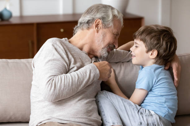 istock Pleasant middle aged man having sincere trustful conversation with grandchild. 1206859199