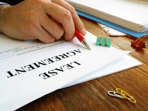 istock Man is signing lease agreement by the pen. 1206860627