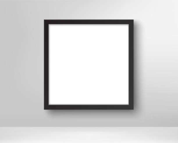 istock Realistic empty black picture frame. Poster in the frame on the wall. Blank white picture mockup template. Vector 1206860628