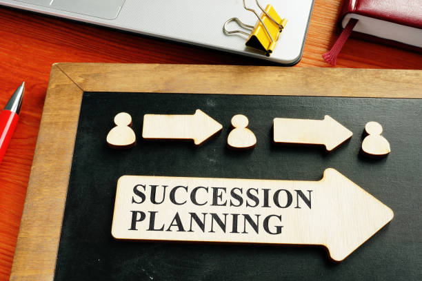 Succession planning concept. Wooden figures and arrows. Succession planning concept. Wooden figures and arrows. continuity stock pictures, royalty-free photos & images