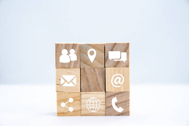 istock Wooden cube with white icons communication - business concept 1206860833