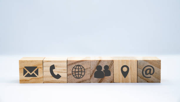 istock Wooden cube with black icons communication - business concept 1206860834
