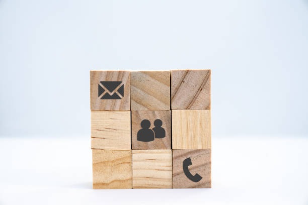 istock Wooden cube with black icons communication - business concept 1206860875