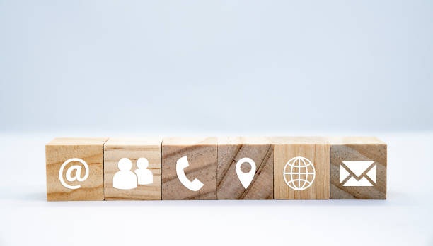 istock Wooden cube with white icons communication - business concept 1206860923