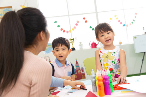 istock Kindergarten teachers and the children 1206862450