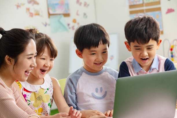 istock The kindergarten children watch video 1206862990