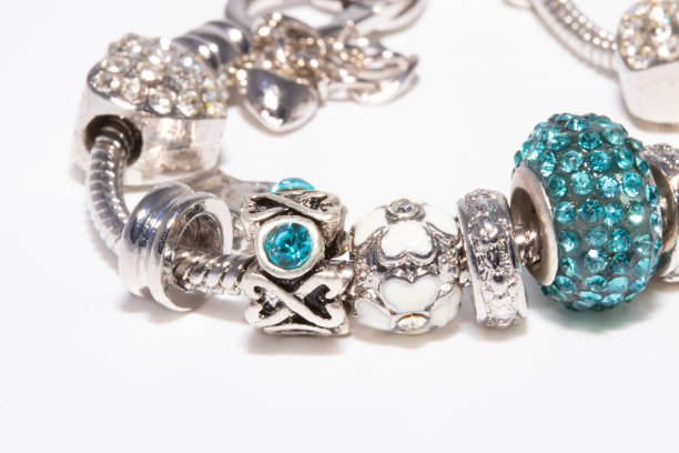 istock Beautiful bracelet with charms isolated on white background 1206863269