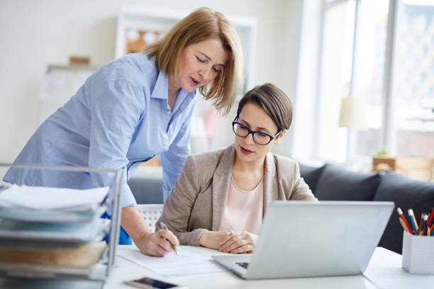 istock Female Manager Talking to Employee 1206864133