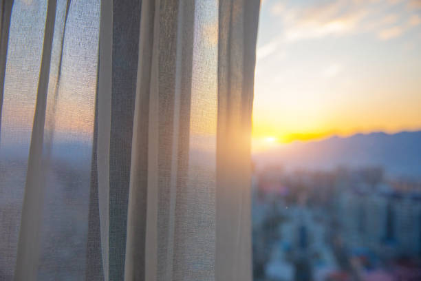 istock Window curtain in the morning 1206867910