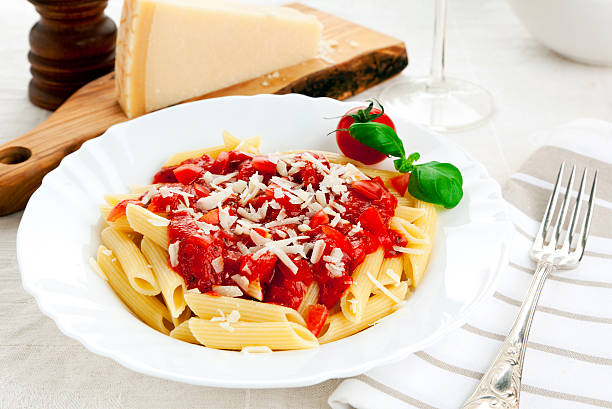 istock penne pasta with tomato sauce and grated parmesan cheese 120686834