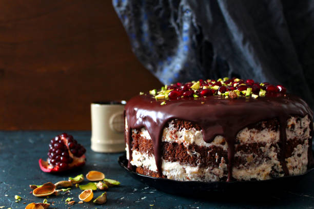 istock Chocolate cake with fruits on dark background. 1206869178