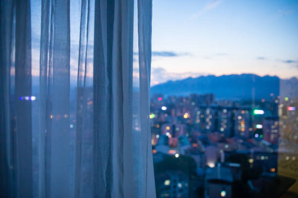 Window with curtain in the night
