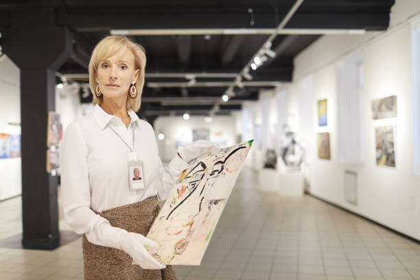 istock Female Art Expert Posing in Gallery 1206870327