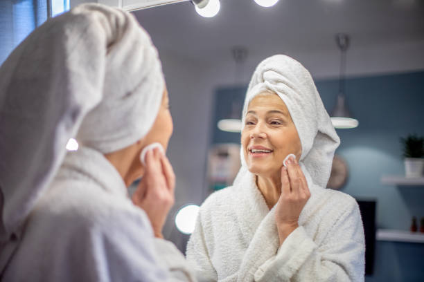 istock Mature woman and her morning beauty routine. 1206870447