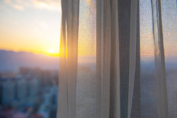 istock Window with curtain in the morning 1206870588