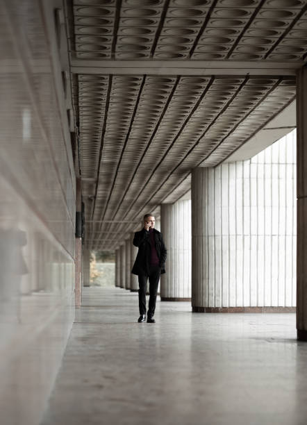 istock Stylish man in black trenchcoat 1206871782