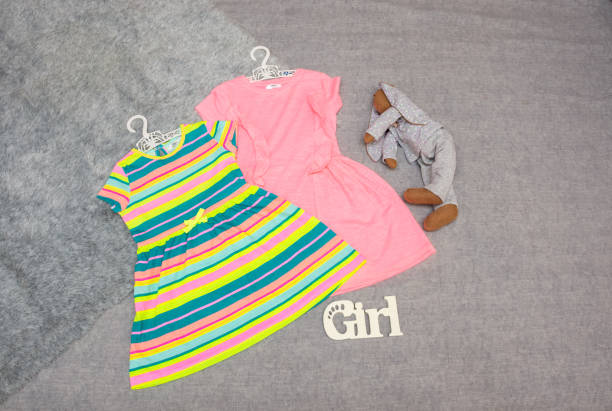 Dresses for little girls on a gray background
