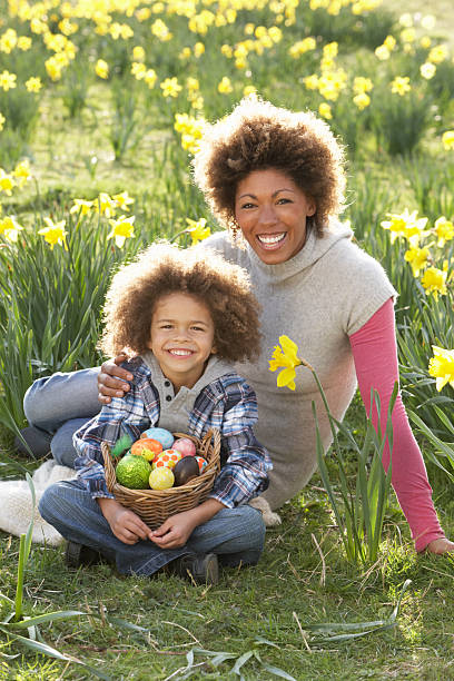 istock Mother And Son On Easter Egg Hunt In Daffodil Field 120687467