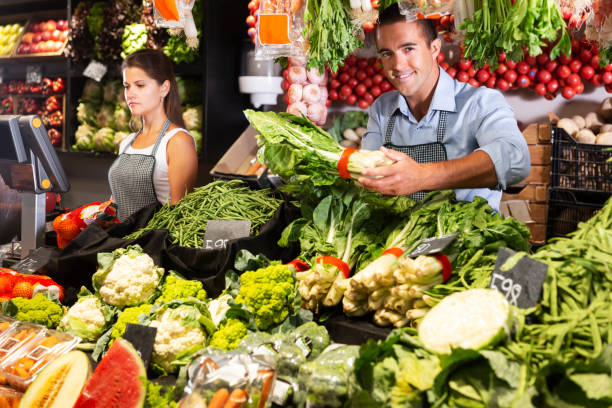 istock Man selling fruits and vegetables 1206876049