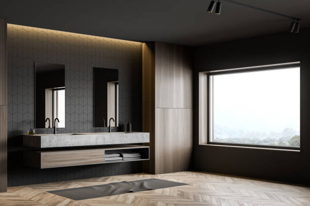 istock Gray tile and wood bathroom corner with sink 1206880667